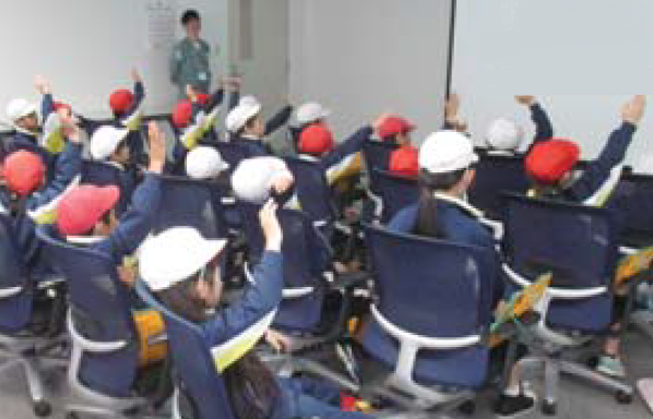 Children eagerly answer quiz questions
